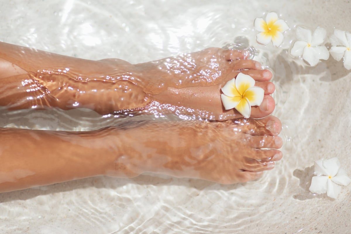 Feet relaxing in a luxurious spa bath for a pedicure